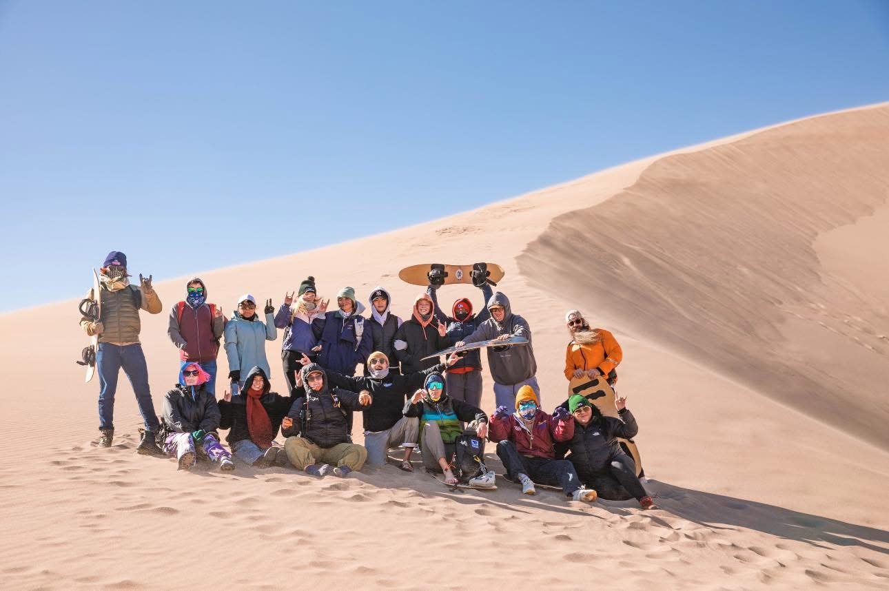 Group enjoying an outdoor sand dunes trip